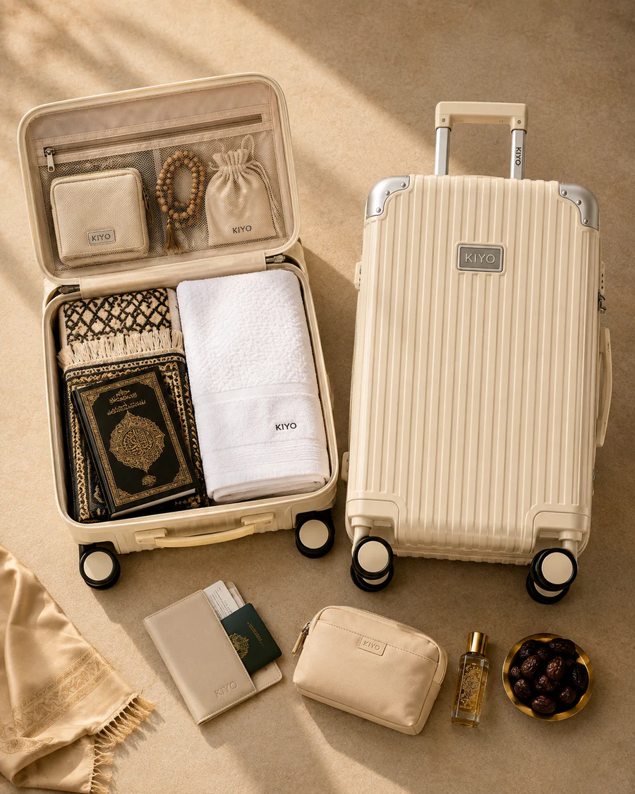 Cream UMRAH luggage arranged with selected prayer and travel essentials